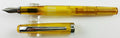 Noodler's Nib Creaper flex fountain pen in Carniolan Honey, uncapped with cap alongside