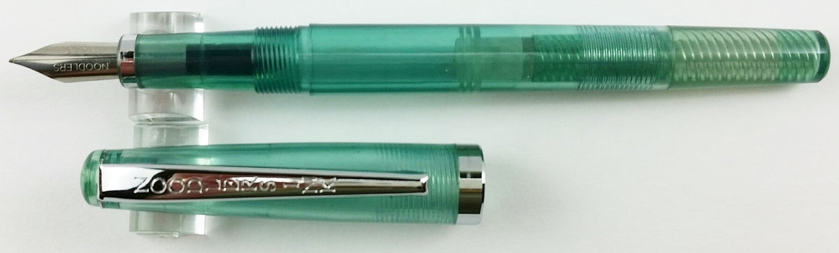 Noodler's Nib Creaper flex fountain pen in Truk Lagoon, uncapped with cap alongside